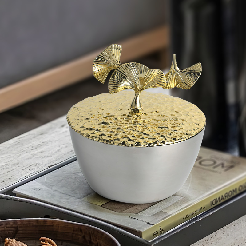 Metal storage jar with ginkgo leaf cover